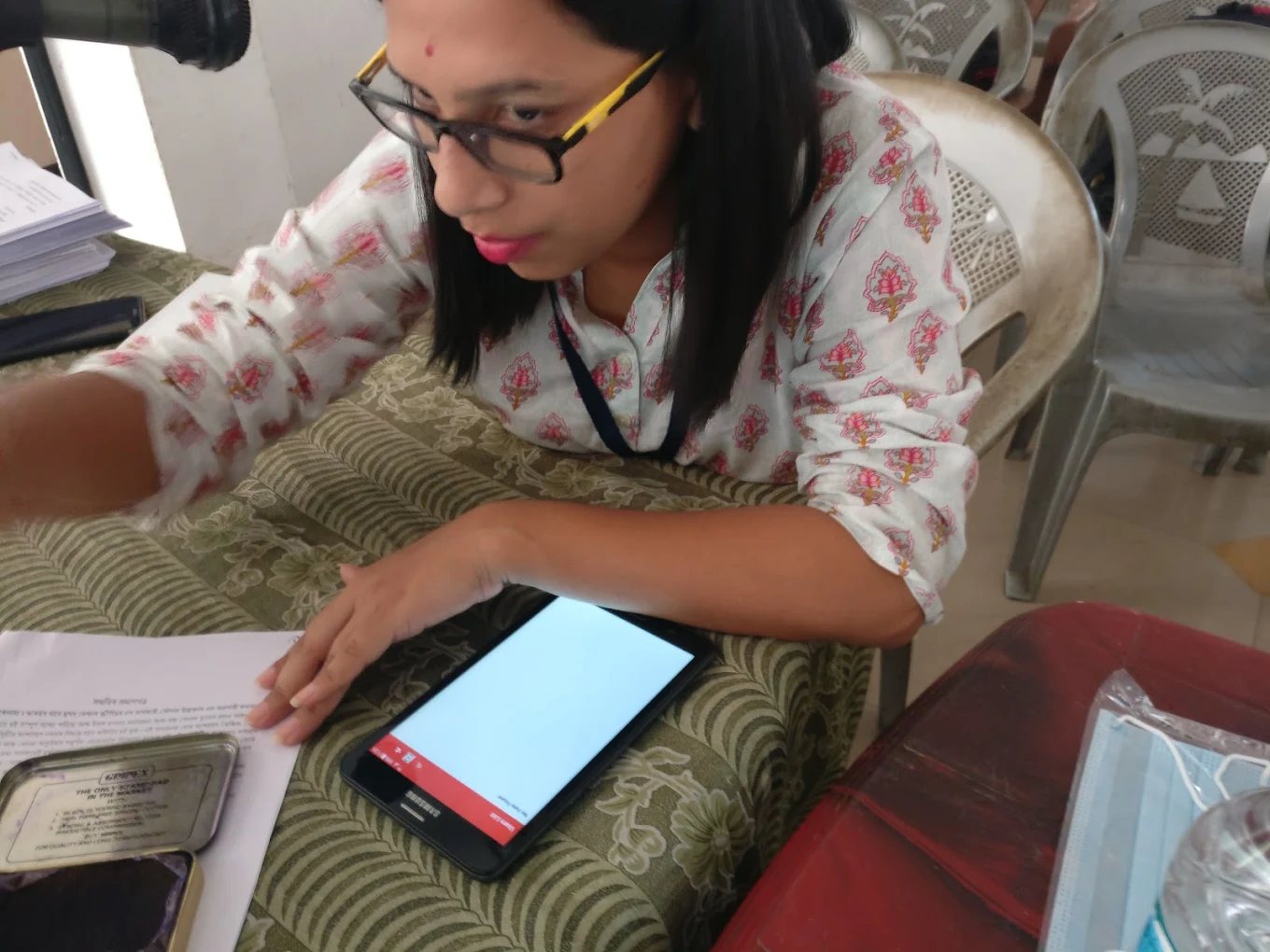A field health worker using the screening app on a tablet — offline-first, with dynamic batch syncing across Assam.